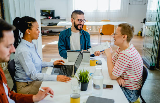Teachers sitting at a table, in a meeting